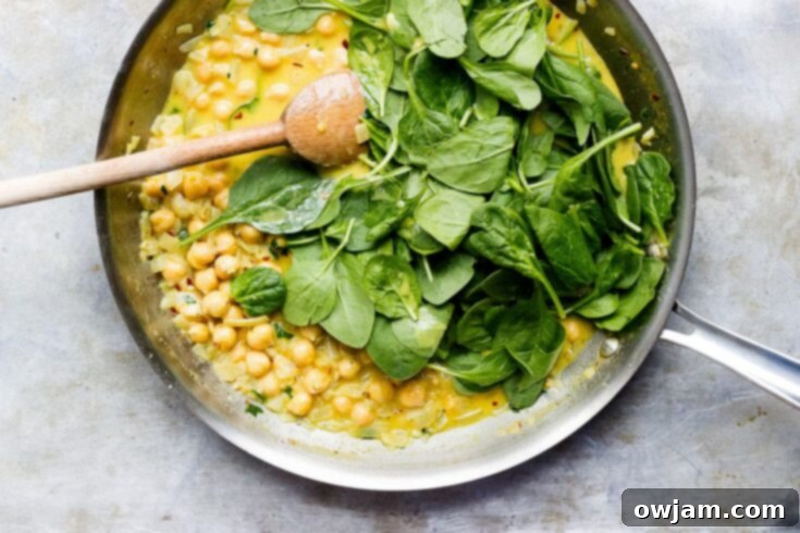 Coconut Curry Chickpeas with Wilted Greens