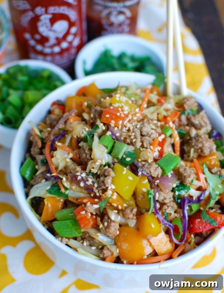 Egg Roll in a Bowl served in a white bowl with a spoon.
