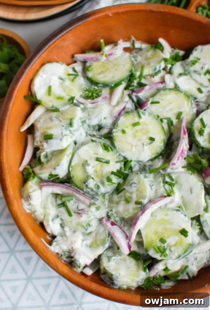 Velvety Cool Cucumber Salad 2 Creamy Cucumber Salad in a rustic wooden bowl, ready to be served