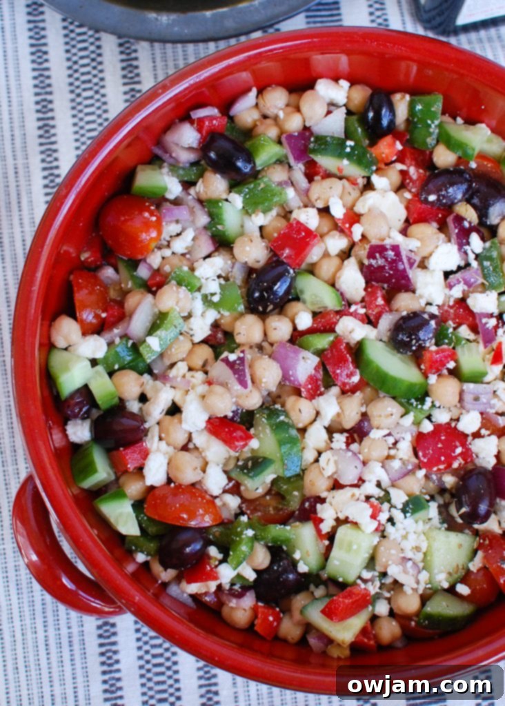 A large bowl of Greek Chickpea Salad, showcasing its colorful and wholesome ingredients.