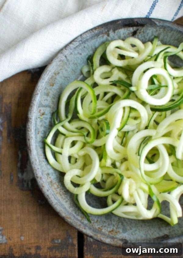 Spicy Asian Chicken Zoodle Soup, illustrating another delicious and healthy use for versatile zucchini noodles in a lightened-up meal.