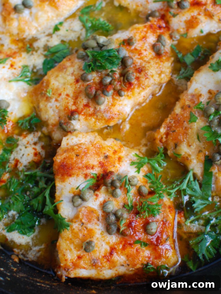 Lemon-Kissed Baked Cod 5 Baked Cod with Lemon in a cast iron skillet