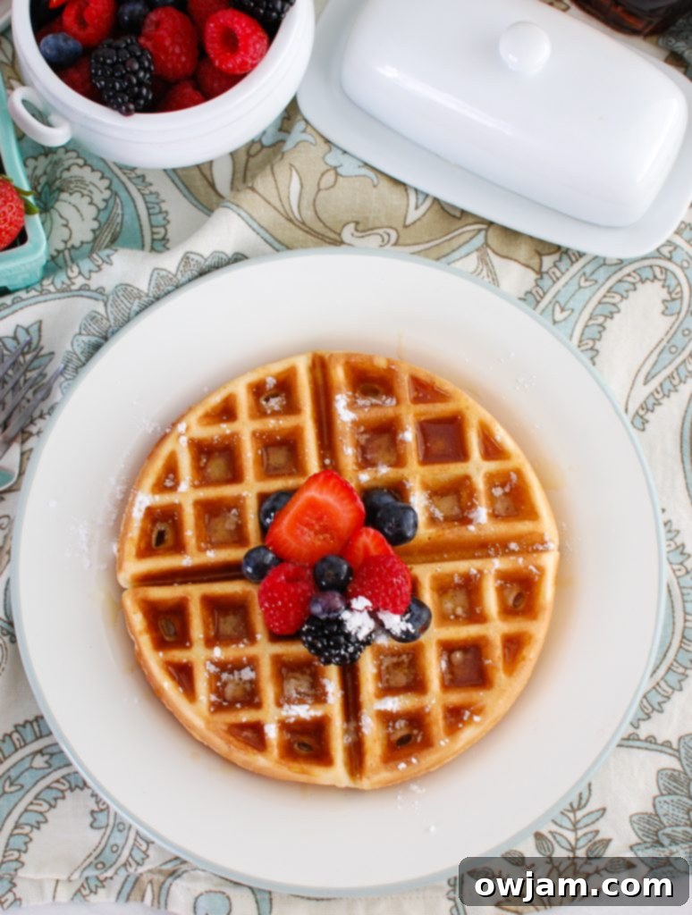 A stack of freshly made Greek Yogurt Waffles, perfectly golden, ready to be customized with favorite toppings.