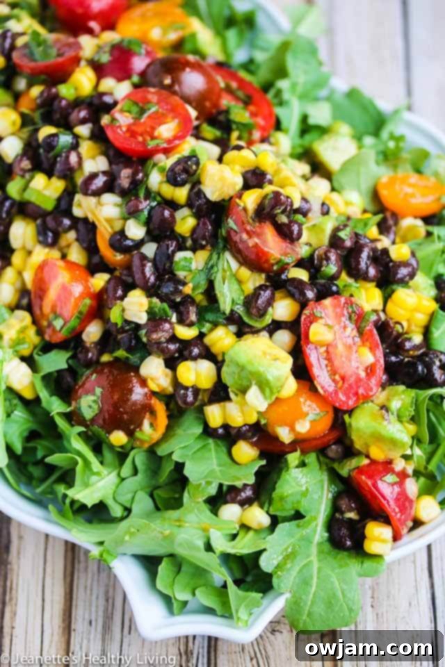 Spicy Chipotle Black Bean Tomato Corn Salad with fresh avocado