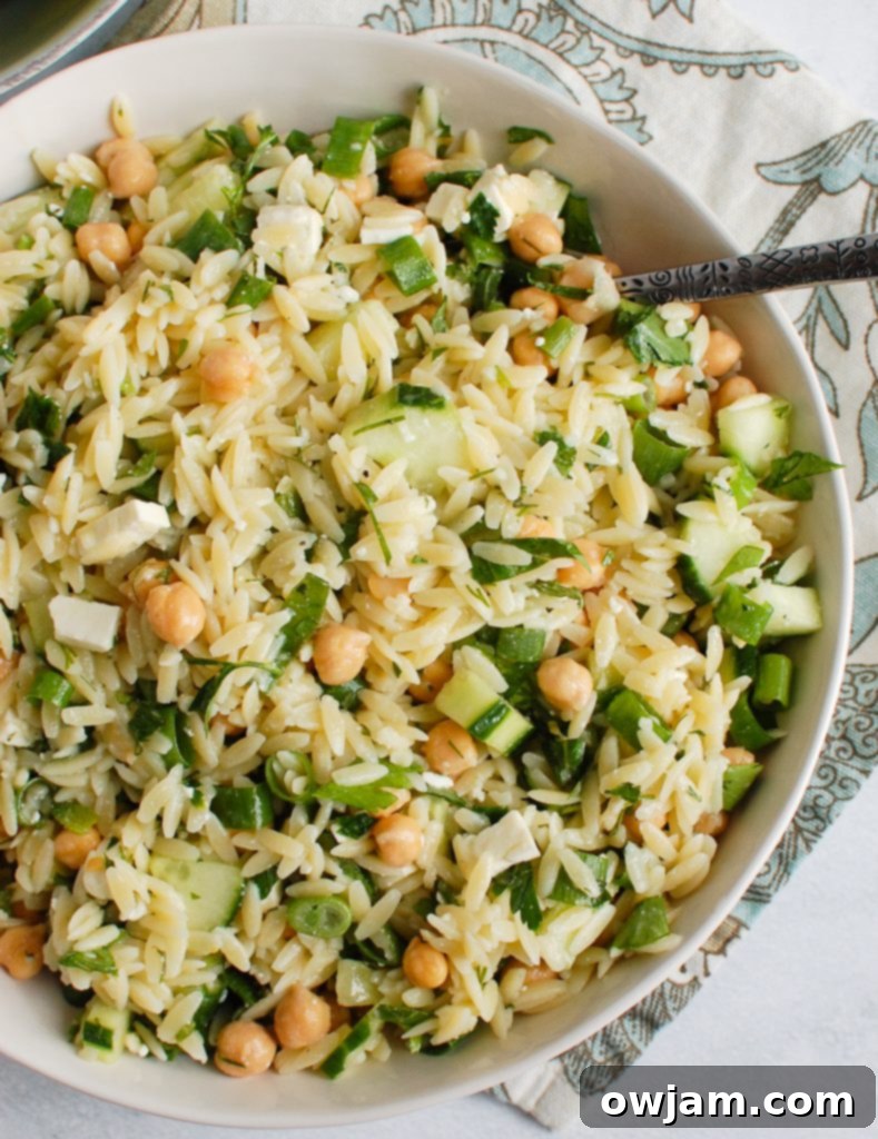 Delicious Chickpea Salad 4 Overhead view of a prepared Chickpea Orzo Salad in a bowl