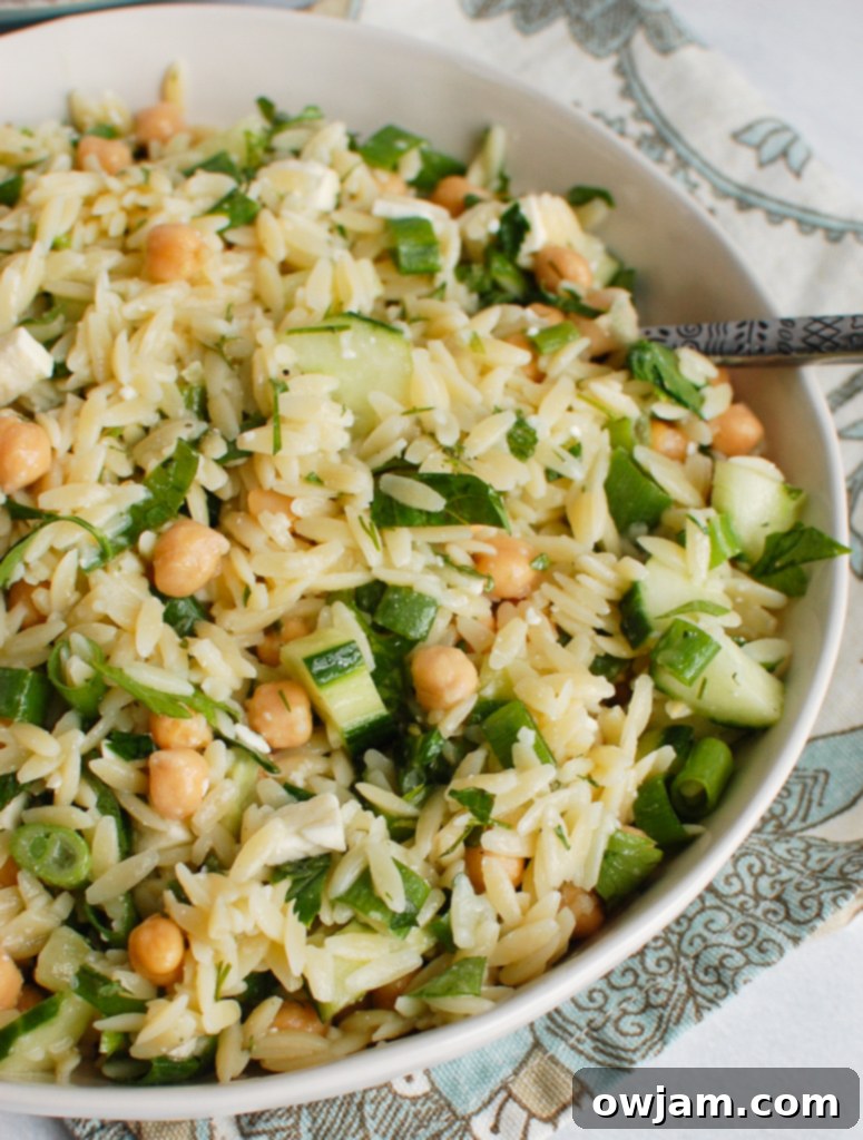 Delicious Chickpea Salad 5 Chickpea Orzo Salad with spoon in a bowl