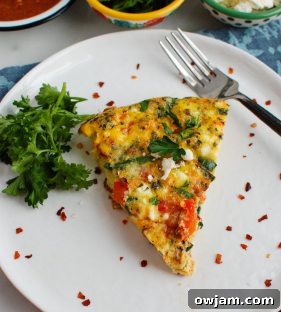 Spiced Moroccan Frittata 2 Mediterranean Frittata on white plate, garnished with fresh herbs