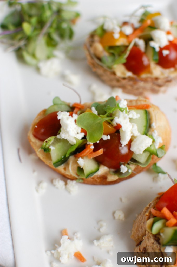 Sun-Kissed Crostini Bites 4 Mediterranean Crostini on a white plate