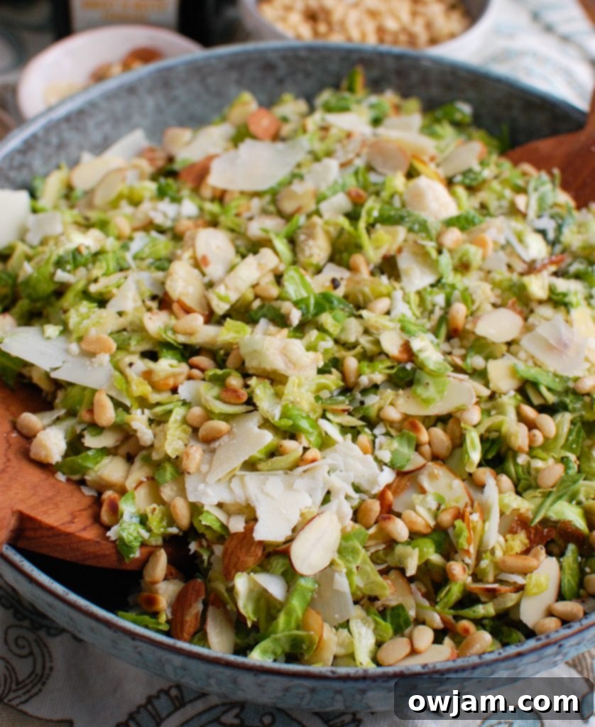 Brussels Ribbon Salad 2 Fresh Shaved Brussels Sprouts Salad in a beautiful blue bowl, ready to serve.