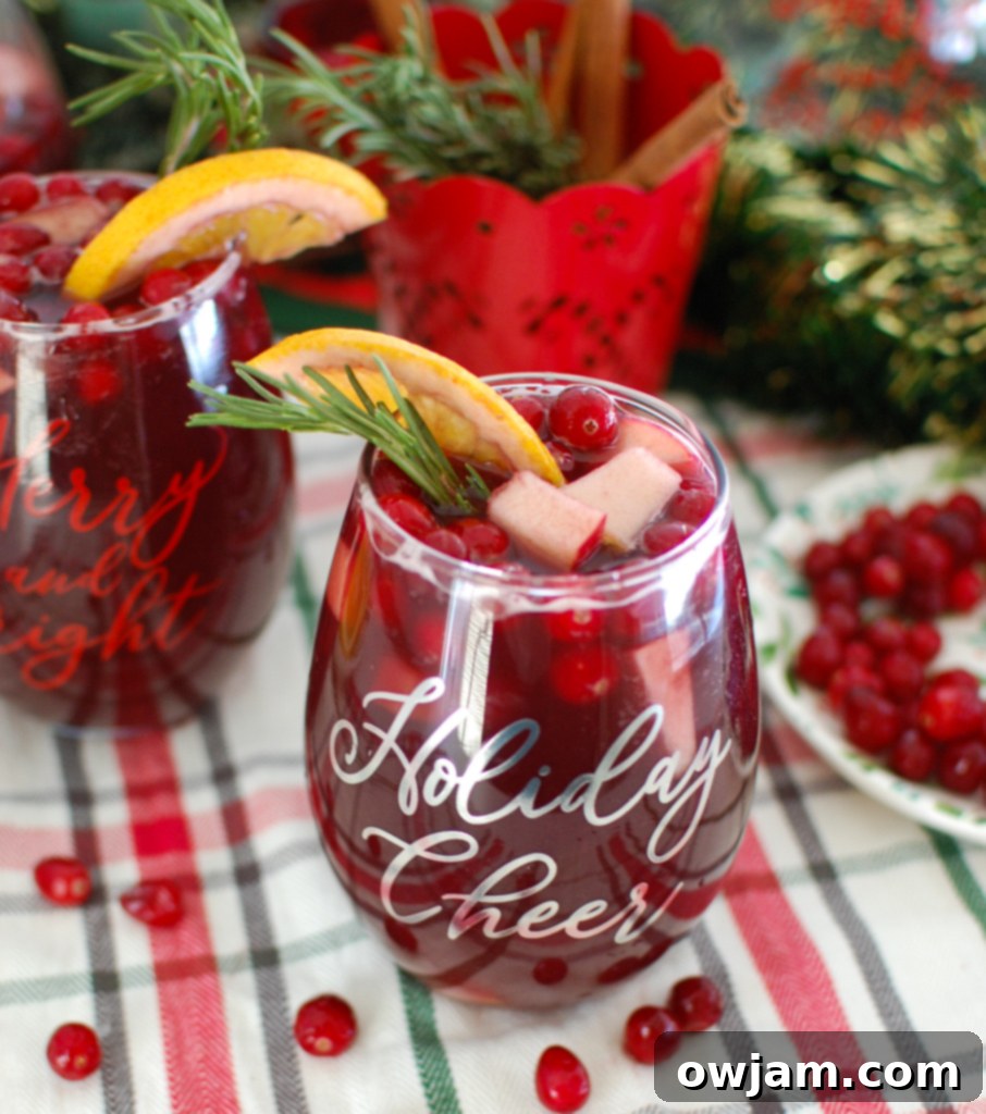 Merry Bright Sangria 3 Christmas Sangria with sliced oranges and apples