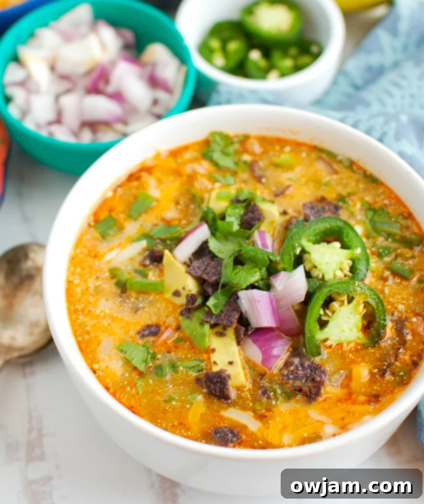 Instant Pot White Chicken Chili garnished with sour cream, avocado, and cilantro