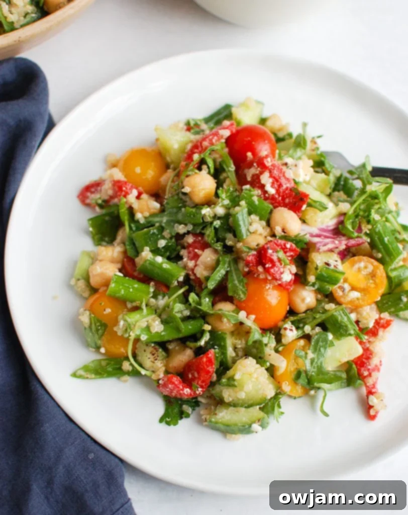 Mediterranean Quinoa Power Bowl 2 Mediterranean Quinoa Salad on white plate, showcasing vibrant ingredients