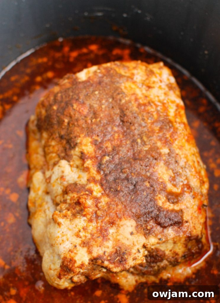 Perfect Slow Cooker Pork Loin 4 Pork Loin in a slow cooker with broth