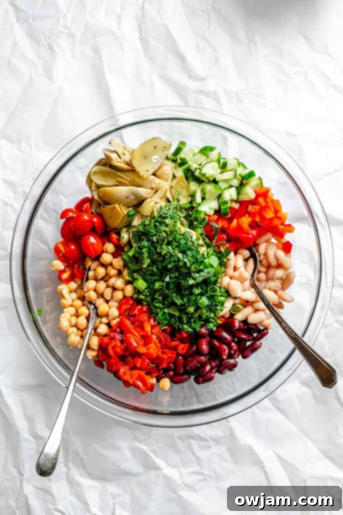 Freshly mixed Mediterranean Three Bean Salad ingredients in a bowl, before dressing.