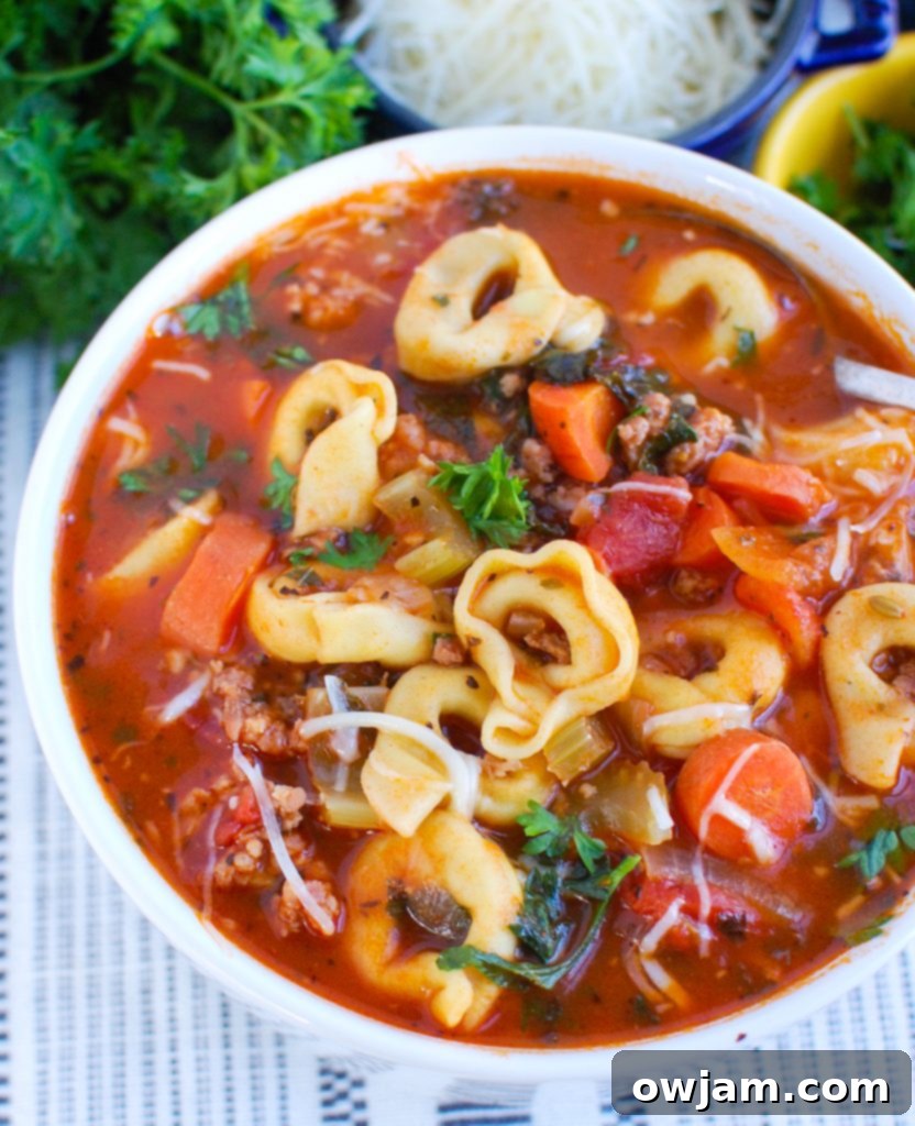 Tortellini Sausage Soup in white bowl 