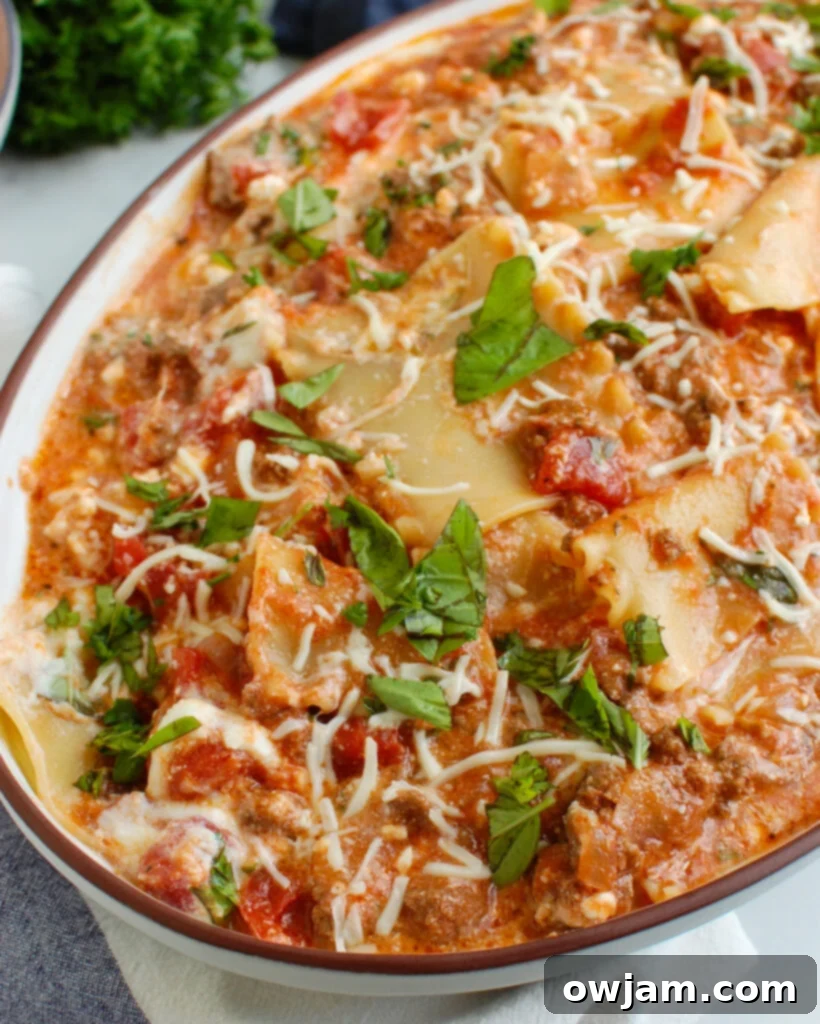 Hearty Skillet Beef Lasagna 3 Freshly cooked Skillet Beef Lasagna garnished with vibrant basil, emphasizing its hearty and quick nature.