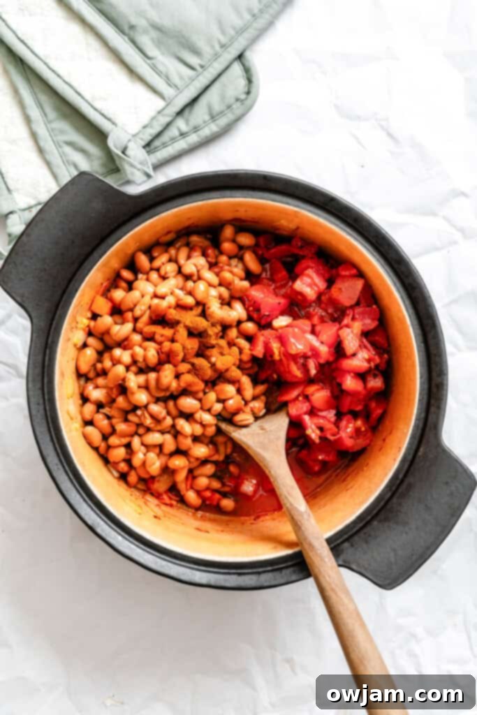 Hearty Homemade Veggie Chili 7 Homemade Vegetarian Chili Recipe in a pot with spoon