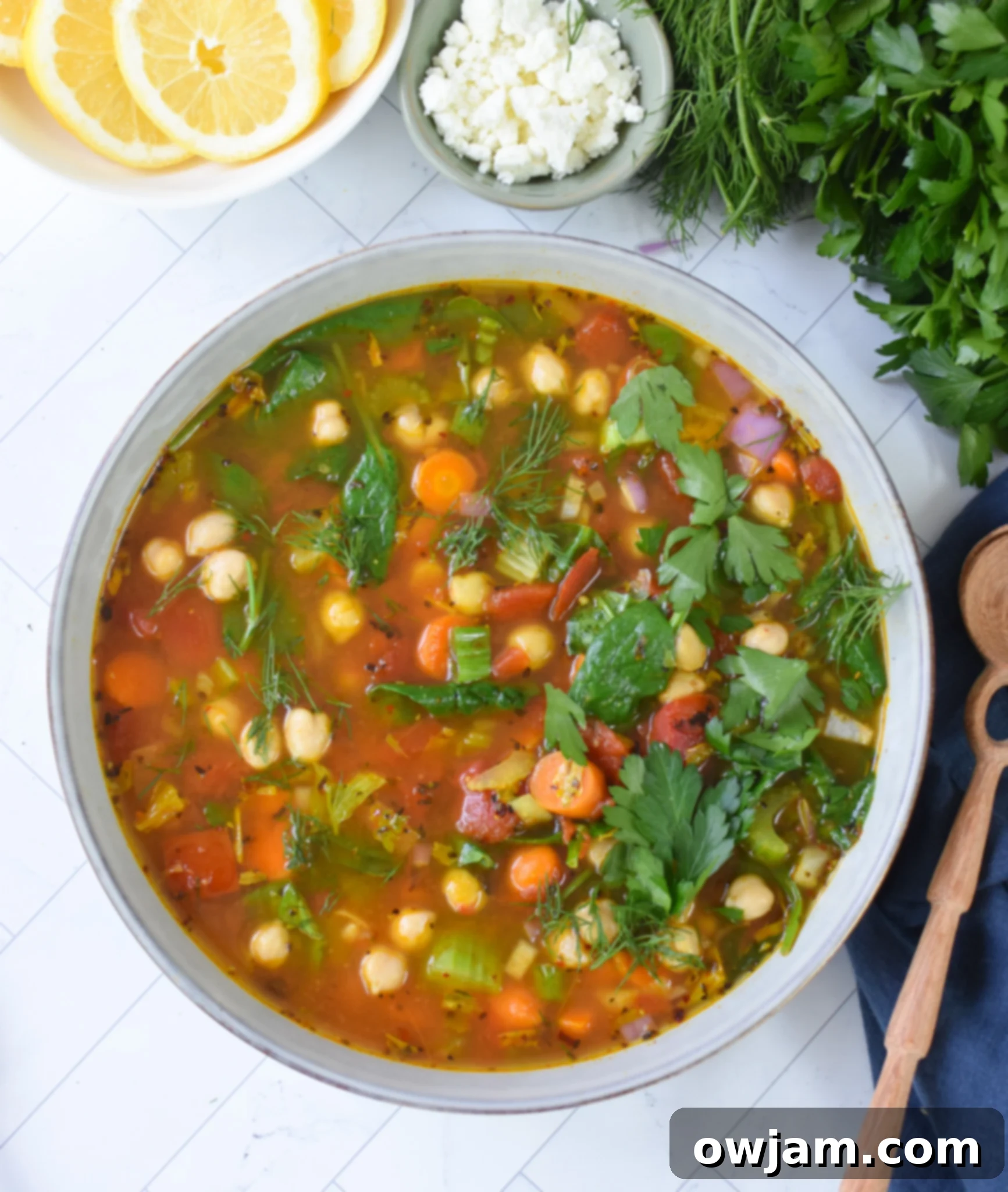 Garbanzo Soup Recipe in a bowl with a spoon and napkin.