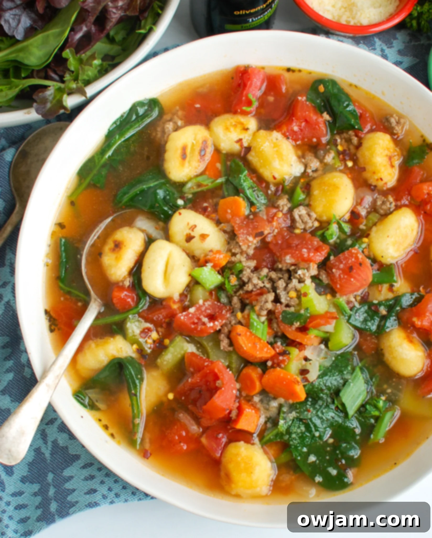 Easy Sausage Gnocchi Soup with spoon. 