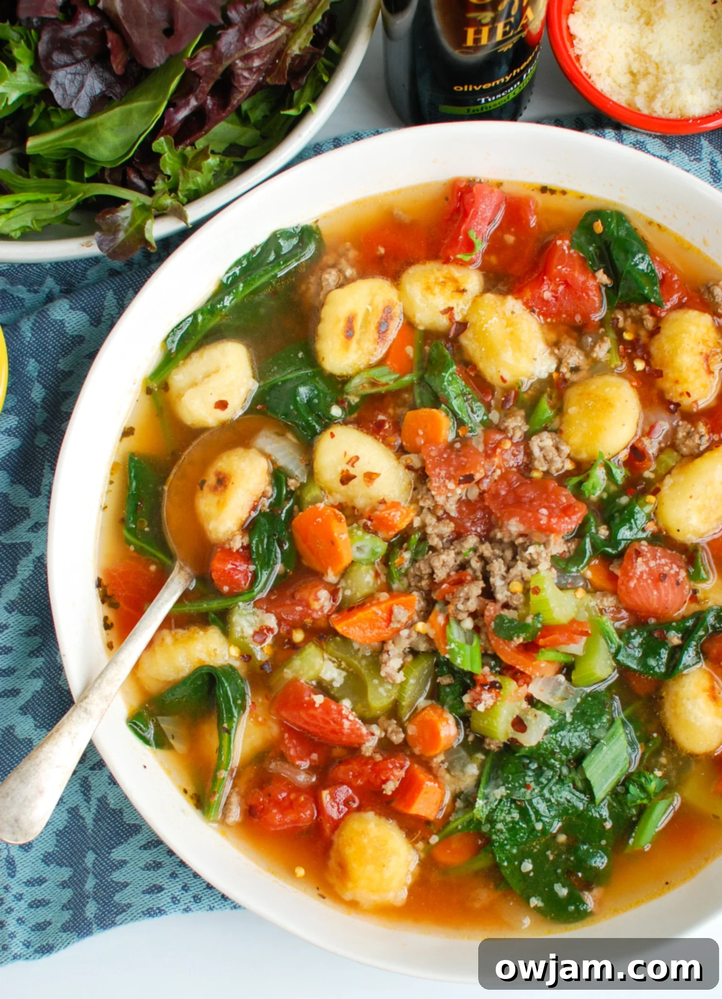 Easy Sausage Gnocchi Soup with blue napkin