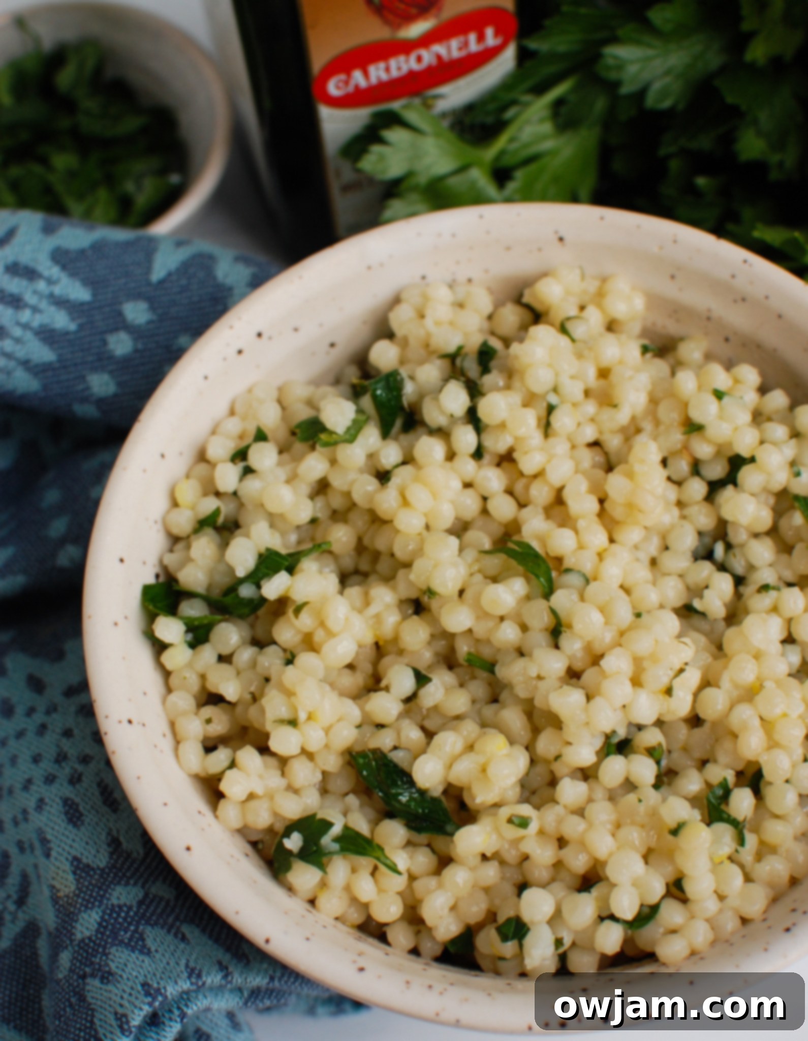 Zesty Lemon Pearl Couscous Delights 2 Lemon Pearl Couscous Recipe in white bowl.