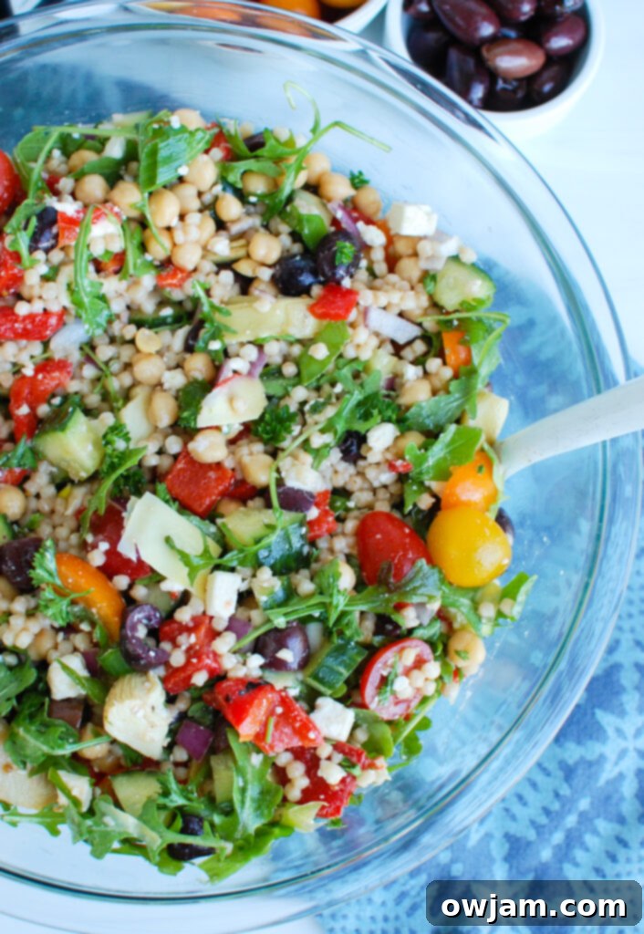 Mediterranean Couscous Salad in clear bowl 