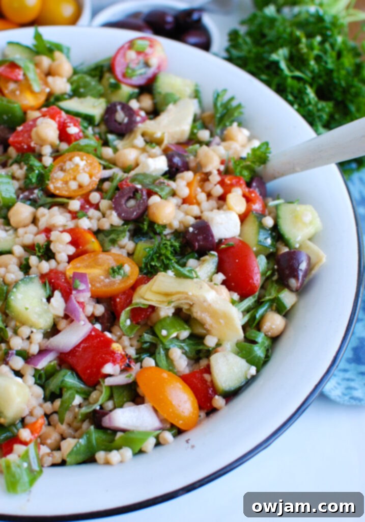Mediterranean Couscous Salad with spoon