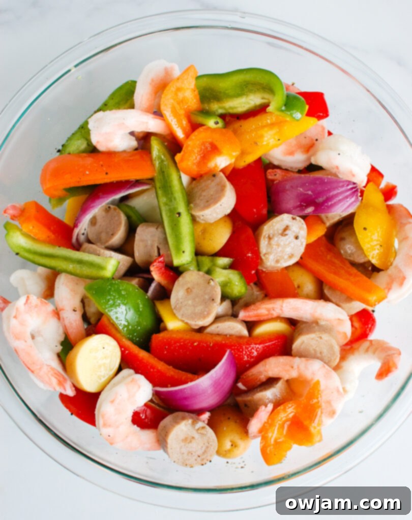 Surf and Turf Foil Delight 3 Sausage and Shrimp Foil Packets in a clear bowl