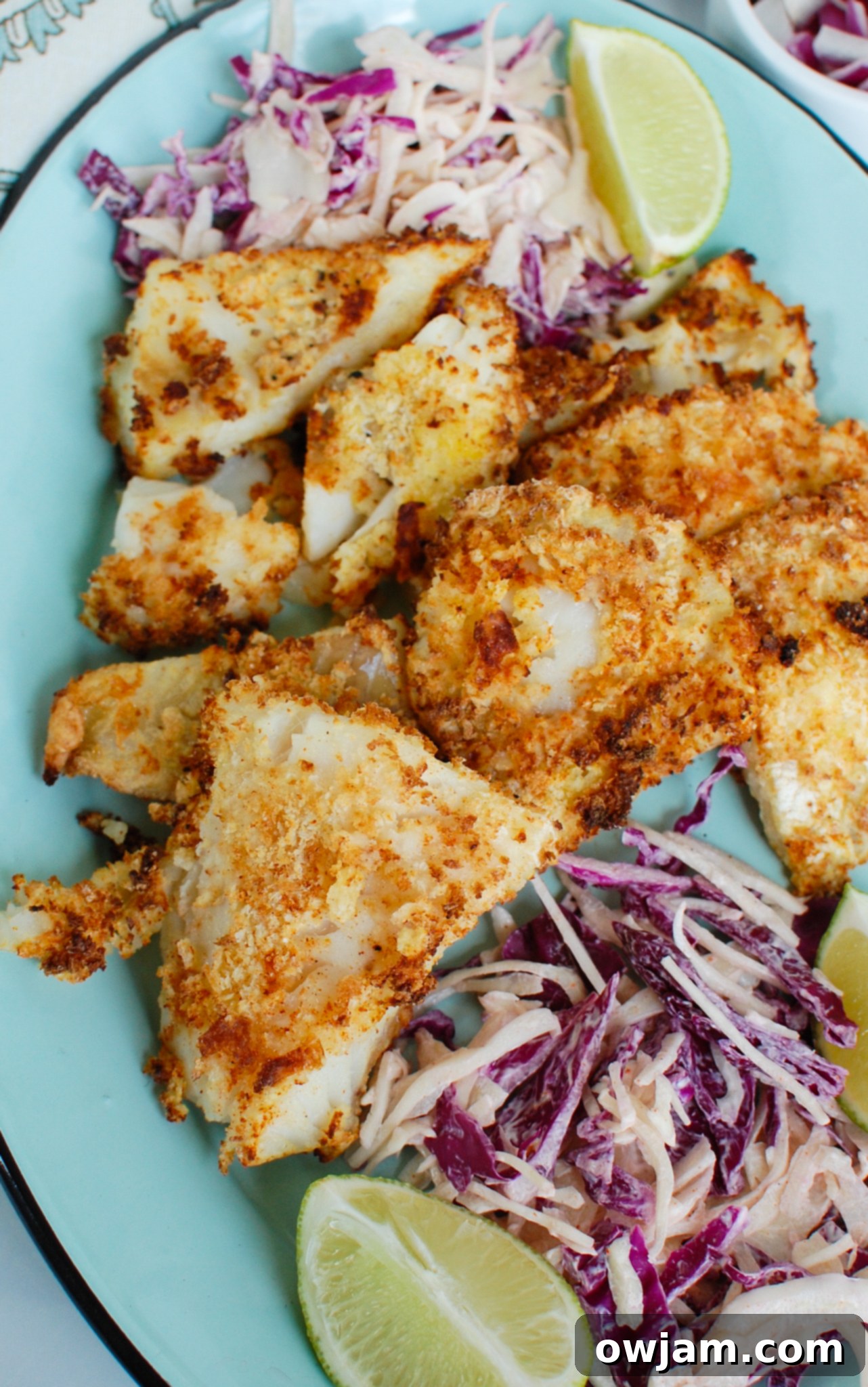 Your Crispy Air Fryer Cod in Just 15 Minutes 2 Air Fryer Cod on a blue plate