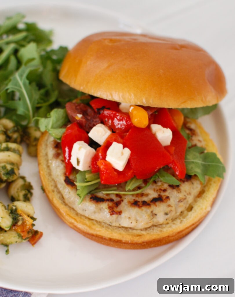 Zesty Greek Chicken Burgers 2 Greek Chicken Burgers on white plate