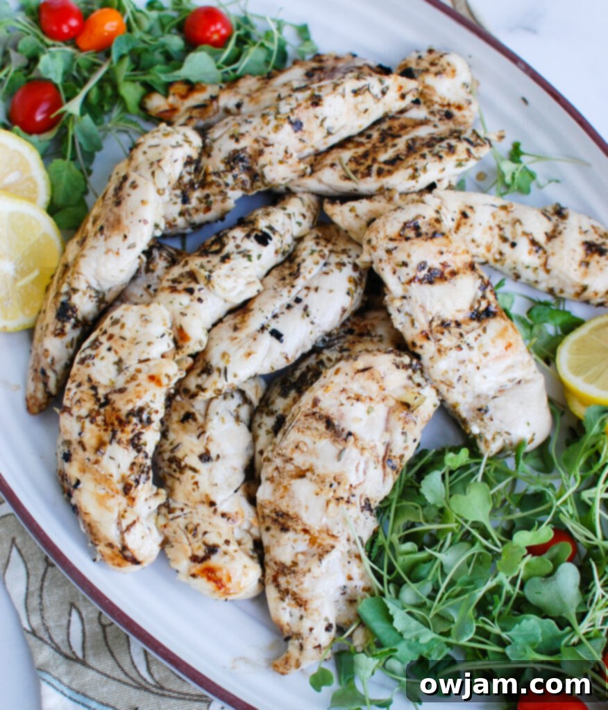 Cooked Lemon Marinade for Chicken served with fresh greens and lemon wedges