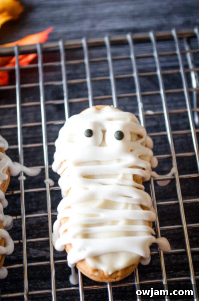 Spooky Bandaged Bites 2 Mummy Cookies on cookie sheet