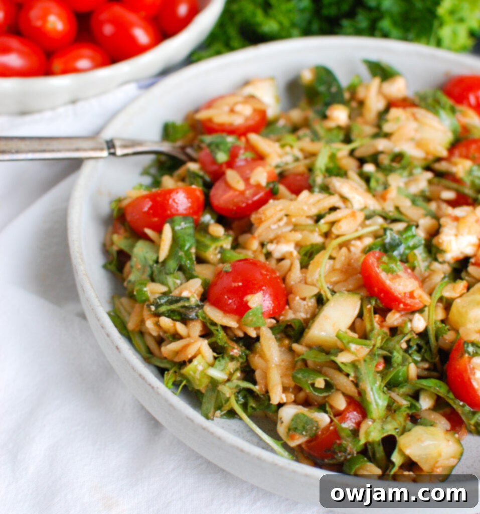 Tomato Feta Orzo Salad with fork