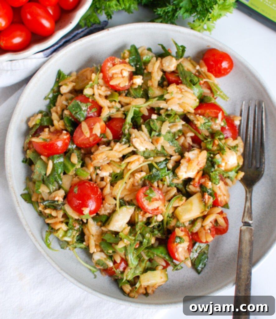 Tomato Feta Orzo Salad with fork