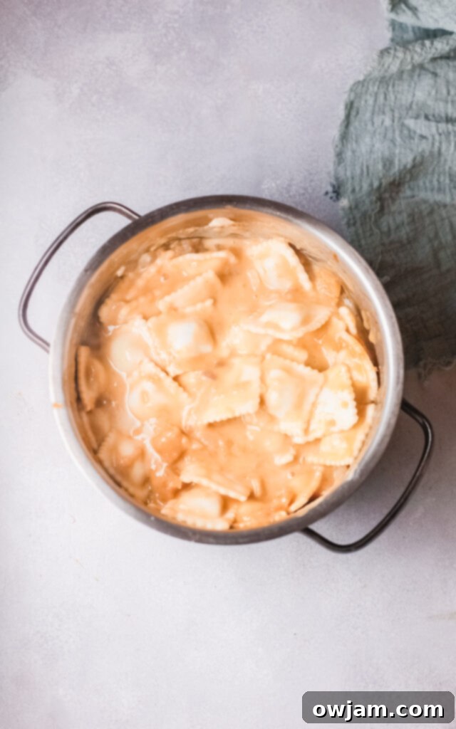 Pumpkin Ravioli in pot with cream