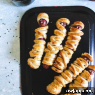 Mummy Hot Dogs on black plate