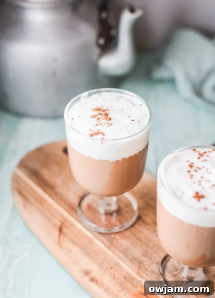 Instant Pot Chai Tea Latte, garnished with a sprinkle of cinnamon, showcasing its inviting presentation.