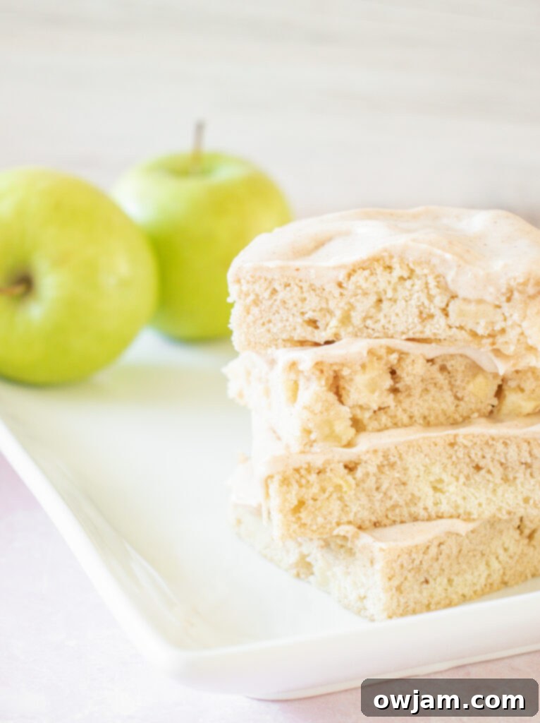 Pumpkin Spice Iced Apple Bars 4 Freshly baked sheet pan of Apple Bars with Pumpkin Pie Spice Icing, ready to be cut and served.