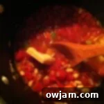 Close-up of bubbling Minestrone soup with pasta and vegetables