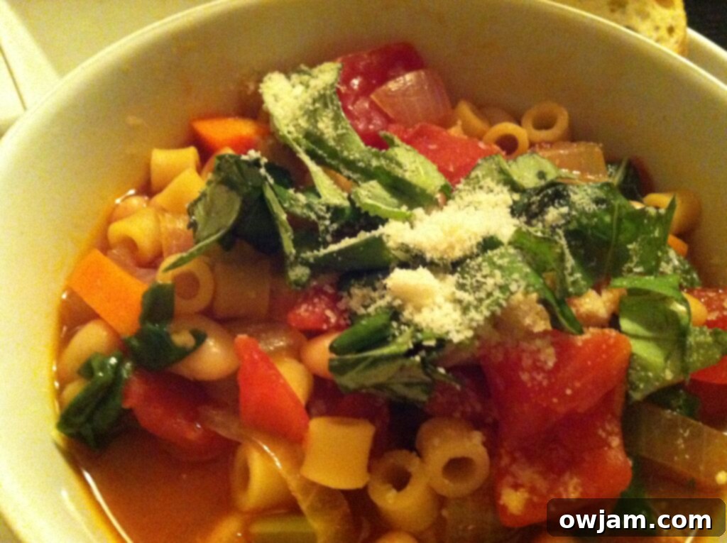 A delicious bowl of Easy Minestrone Soup, garnished and ready to eat