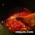 Ingredients simmering together in a pot to create the Minestrone soup base