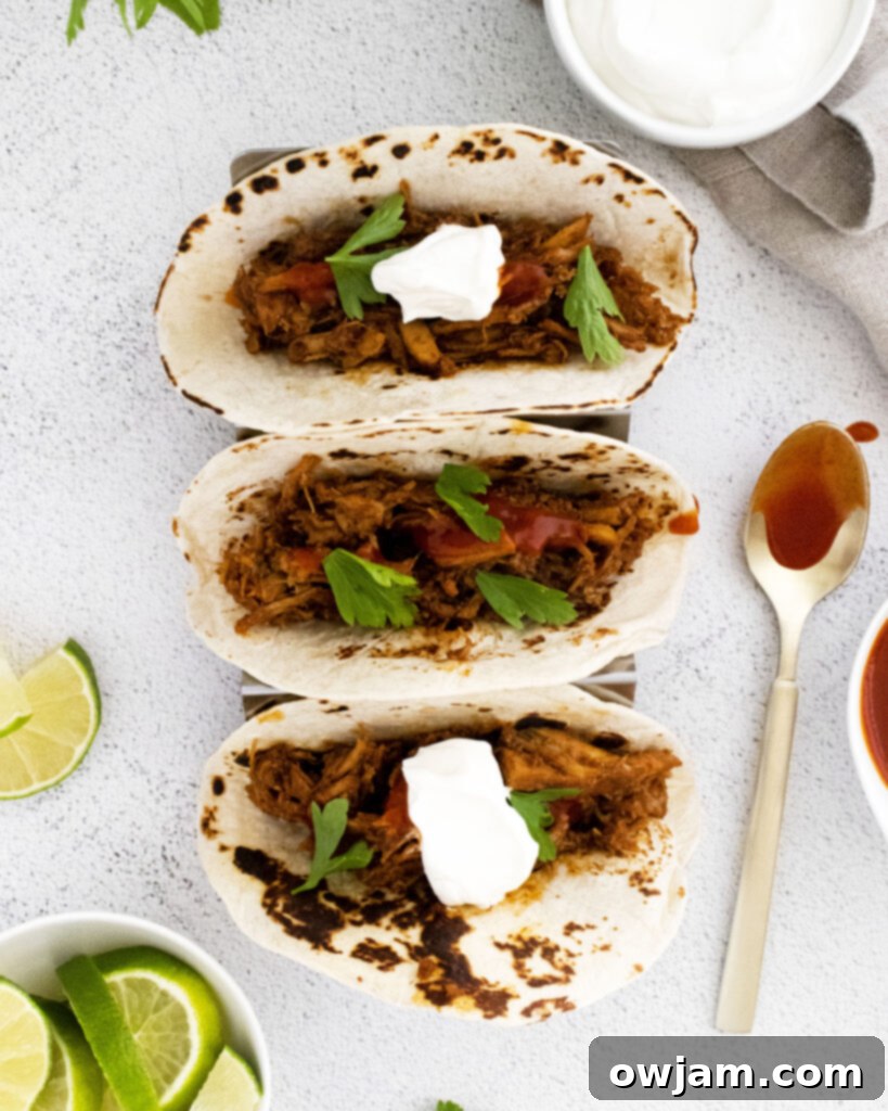 Instant Pot Carnitas Recipe in taco holder 
