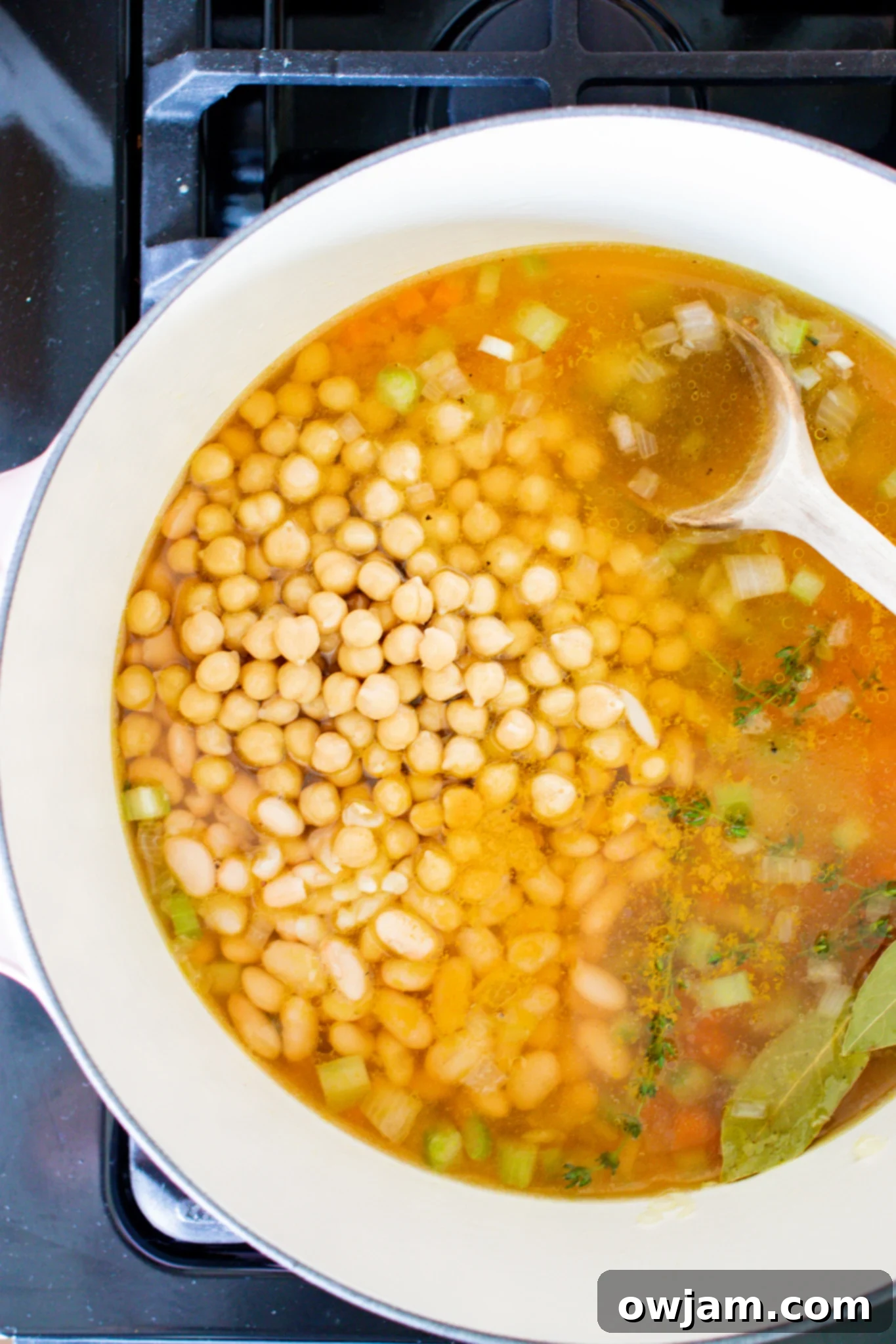 Effortless Vegetable Bean Soup 7 Easy Vegetable Bean Soup Recipe garnished with fresh herbs in a white bowl