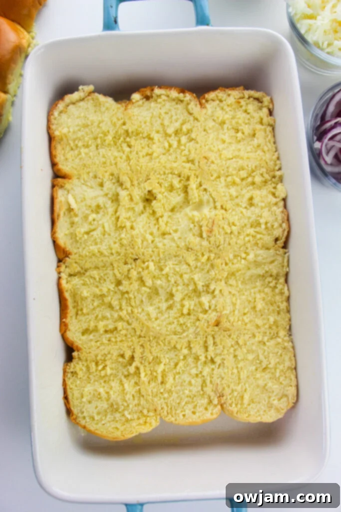 Bottom layer of slider buns in a baking dish