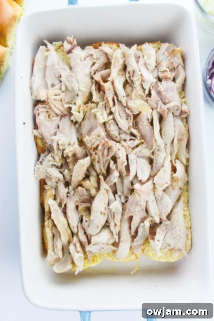 Easy Chicken Sliders with chicken layered on buns