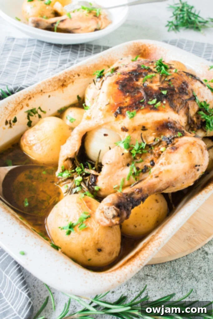 Whole Roasted Chicken with Potatoes in pan