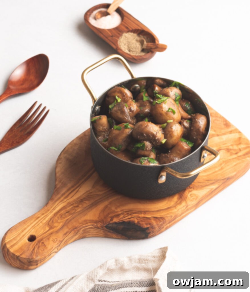 Garlic Sautéed Mushrooms on wood board 