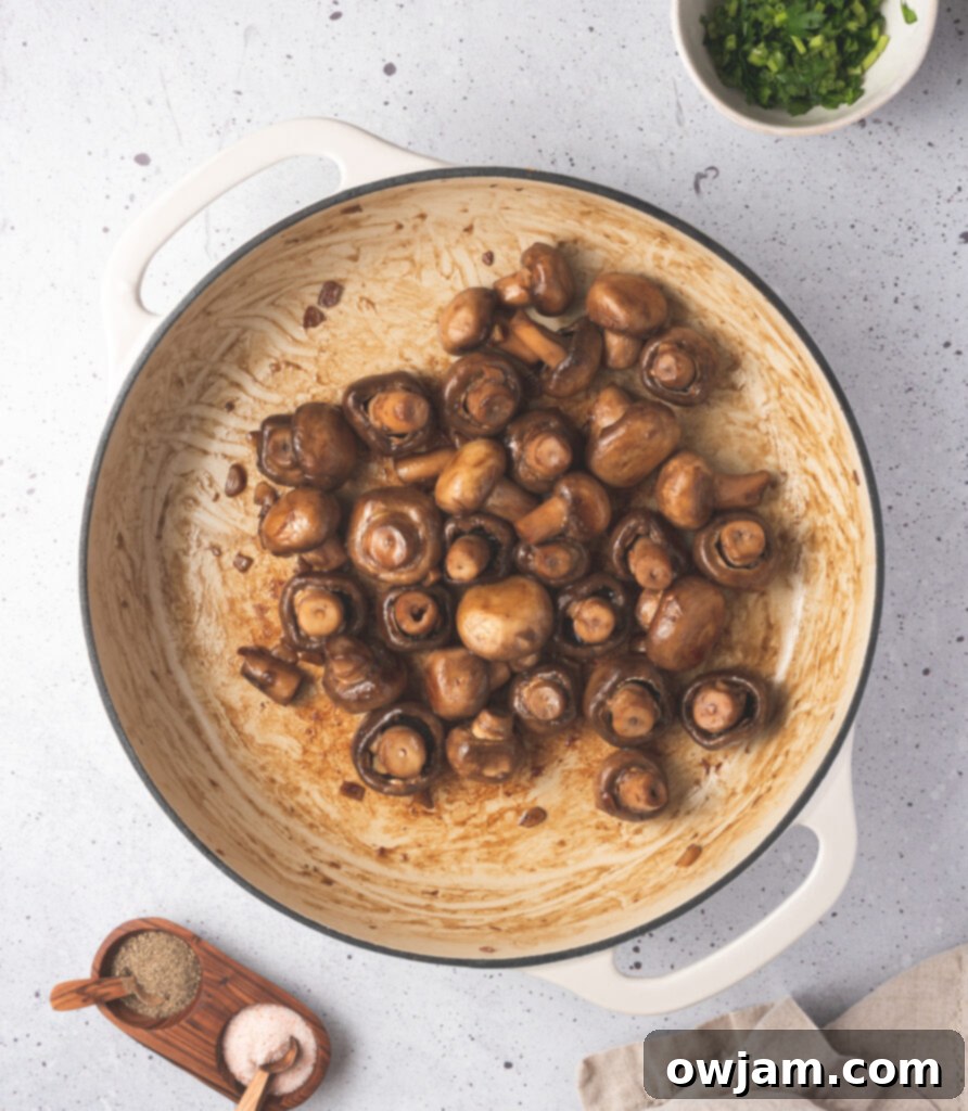 Garlic Sautéed Mushrooms in pot with oil 