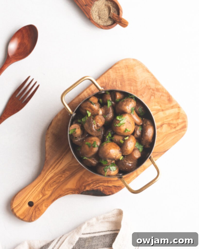 Garlic Sautéed Mushrooms on wood board 