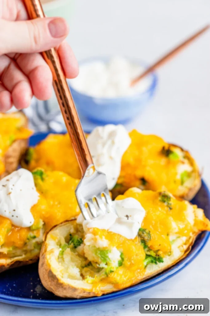 Air Fryer Twice Baked Potato with a fork showing fluffy interior
